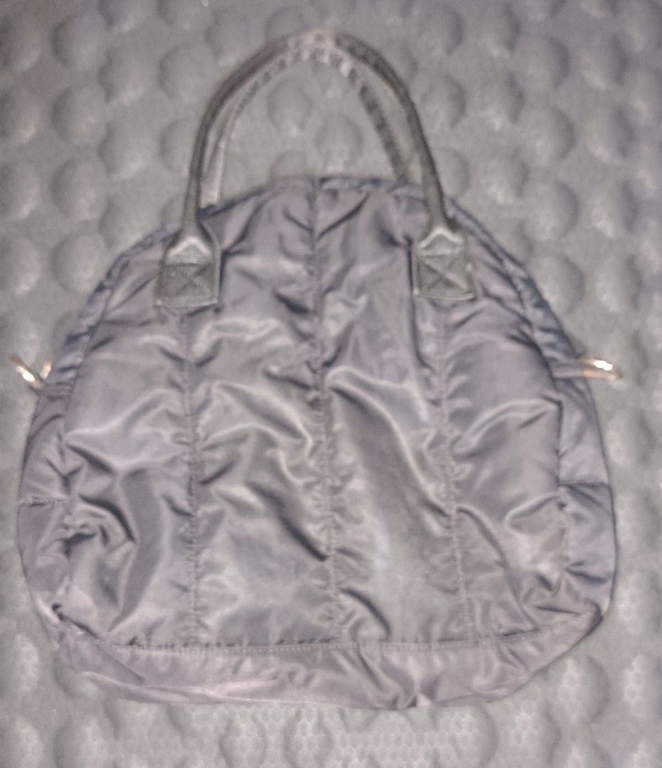 M+FG Black Puffer Tote Bag (Category: Tote Bags) located in Makati City. Submitted by breispreloved (Listing ID 1446508869, Image 2). Description: - M+FG black puffer tote bag - Features a front zip pocket - Comfortable top handles - Zipper pull with M+FG logo - Signs ns of wear on hardware - Signs of usage - Ideal for carrying your daily essentials.
