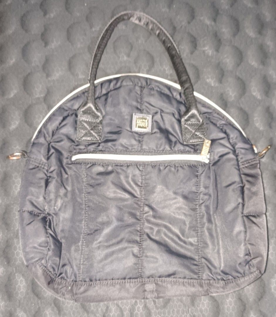 M+FG Black Puffer Tote Bag (Category: Tote Bags) located in Makati City. Submitted by breispreloved (Listing ID 1446508869, Image 1). Description: - M+FG black puffer tote bag - Features a front zip pocket - Comfortable top handles - Zipper pull with M+FG logo - Signs ns of wear on hardware - Signs of usage - Ideal for carrying your daily essentials.