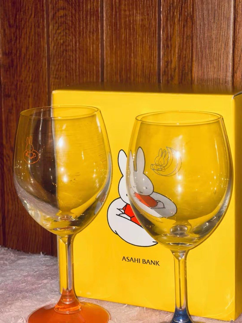 Miffy Asahi Bank Wine Glasses Set (Category: Dinnerware & Cutlery) located in Caloocan City. Submitted by miffuph (Listing ID 1446410588, Image 2). Description: - Set of two Miffy wine glasses - One glass has an orange base, the other has a blue base - Both glasses feature charming Miffy illustrations - Comes with the original Asahi Bank box - Ideal for Miffy enthusiasts and collectors.