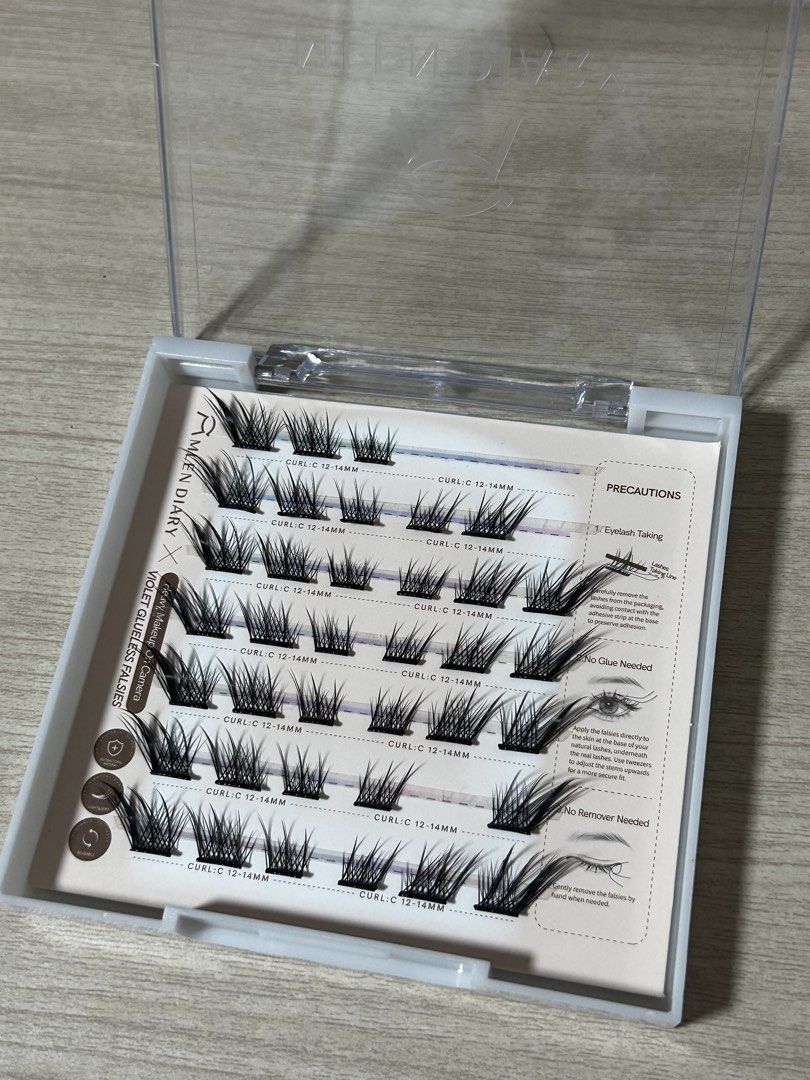 MLEN Diary & Elyzza Cluster Lashes w/ free tweezers (Bundle) (Category: Makeup) located in Quezon City. Submitted by lynloved (Listing ID 1446509036, Image 3). Description: ☆ MLEN Diary Baby Comic (NOT glueless) ⟡ Lash glue - unused ☆Elyzza Kitty Paws Glueless Cluster Lashes ☆ Elyzza Violet Glueless ClusterLashes ☆ With free tweezers and hand mirror from MLEN! ☆ Payment: Any E-wallet (through my QR) - Payment first.