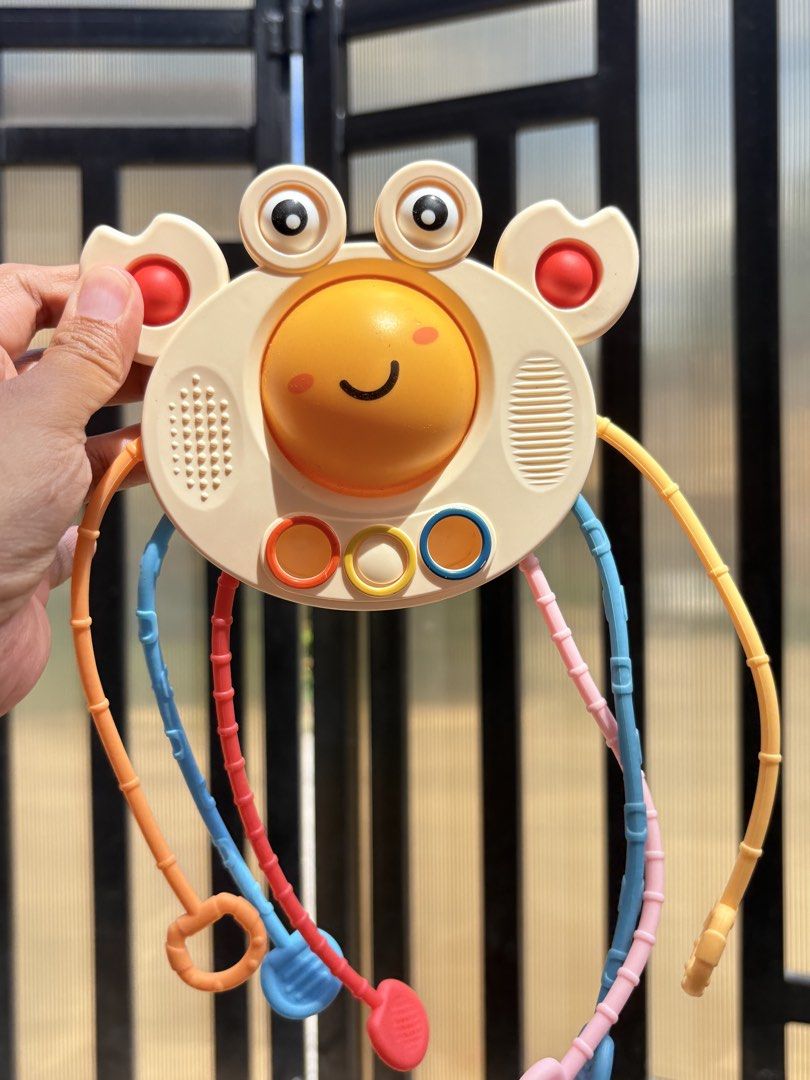 Montessori Sensory Pull String Toy for Babies (Category: Infant Playtime) located in Manila. Submitted by biboystoyhouse (Listing ID 1446441356, Image 2). Description: - Fun sensory toy for babies - Features colorful pull strings and textured surfaces - Excellent for developing fine motor skills - Encourages sensory exploration with engaging colors and textures - Designed for small hands to grasp and manipulate easily - Perfect travel companion f