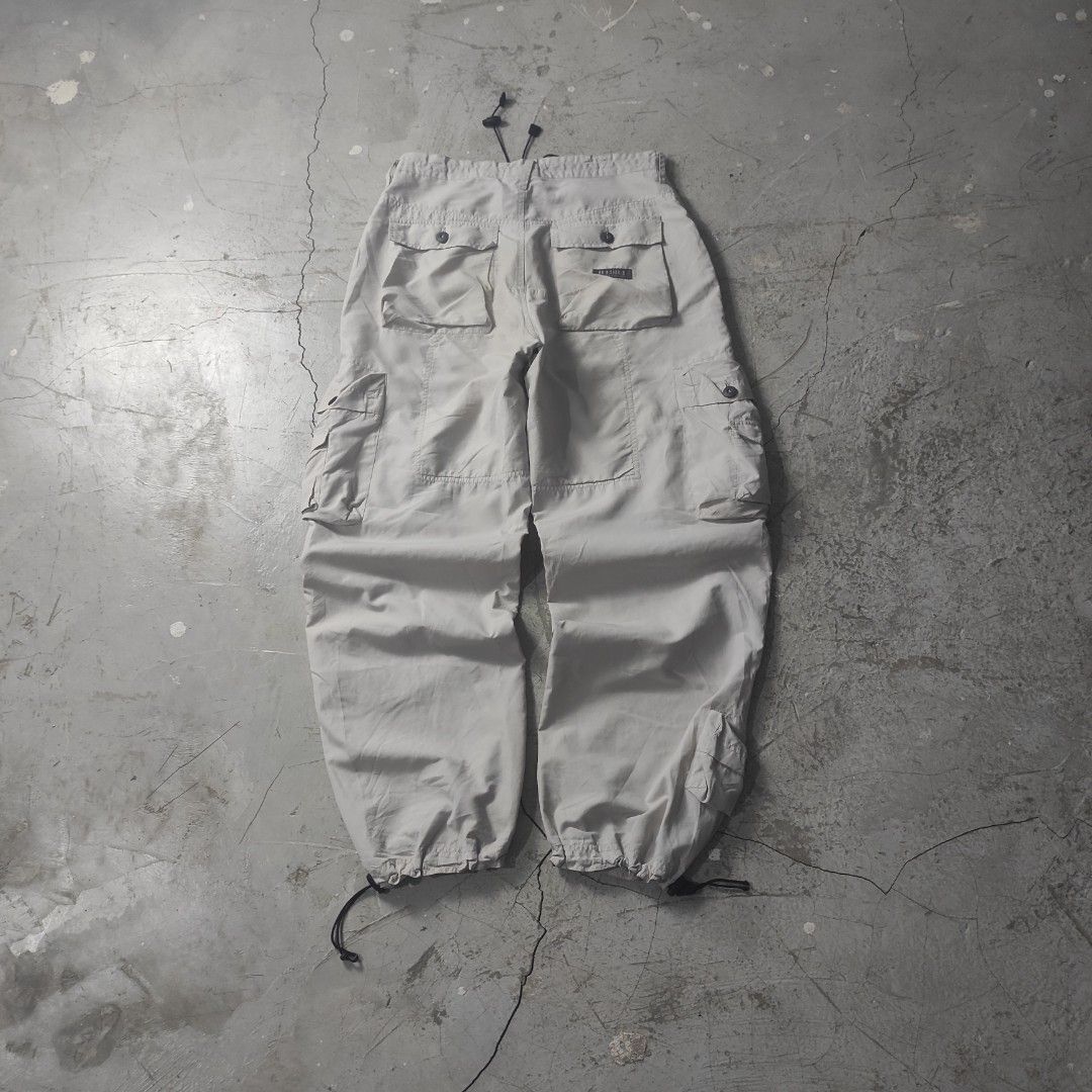 Multipocket Parachute Baggy Cargo Pants (Category: Activewear) located in Batangas. Submitted by vtgrags_ (Listing ID 1446495229, Image 2). Description: Multipocket Parachute Baggy Cargo Pants Size on Tag : Small on Tag Measurement : Waist : 32' Inches Rise : 12' Inches Inseam : 31' Inches Full Length : 42' Inches Leg Opening : 9' Inches ( Adjustable ) Color : Bone White Condition : Very Good Condition Issue : No Issue .