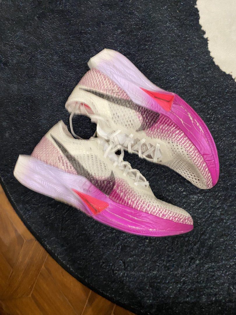 Nike ZoomX Vaporfly 3 (Category: Sneakers) located in Angeles City. Submitted by thecurator.67 (Listing ID 1446470881, Image 1). Description: - High-performance road racing shoe ( Very lightweight) - Colorway: Vivid Purple - Carbon plated - Mileage (41km only) - Bought it for 12,000 at Nike Outlet Clark - In very good condition. Noticeable signs of usage. - Issues heel drags and compression marks on foam (see pictures) - For performance foams lik