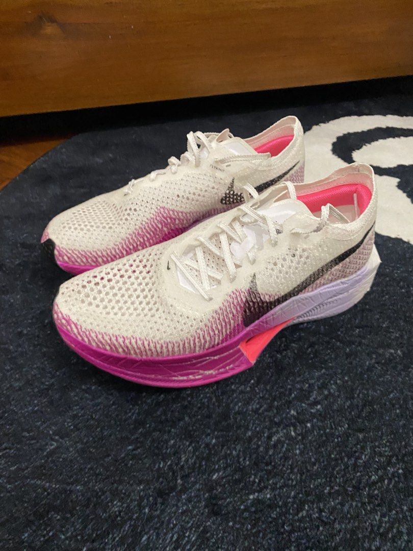Nike ZoomX Vaporfly 3 (Category: Sneakers) located in Angeles City. Submitted by thecurator.67 (Listing ID 1446470881, Image 3). Description: - High-performance road racing shoe ( Very lightweight) - Colorway: Vivid Purple - Carbon plated - Mileage (41km only) - Bought it for 12,000 at Nike Outlet Clark - In very good condition. Noticeable signs of usage. - Issues heel drags and compression marks on foam (see pictures) - For performance foams lik