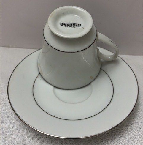 Noritake Legacy "Regency Silver" Cup and Saucer Set (Category: Coffee & Tea Tableware) located in Quezon City. Submitted by lopezlavi (Listing ID 1446417348, Image 2). Description: The Design relies entirely on a crisp, stark white porcelain canvas featuring no central patterns, floral decorations, or graphics. The clean look is defined by a thin, highly polished platinum silver rim running along the top of the flared cup and outer edge of the sa