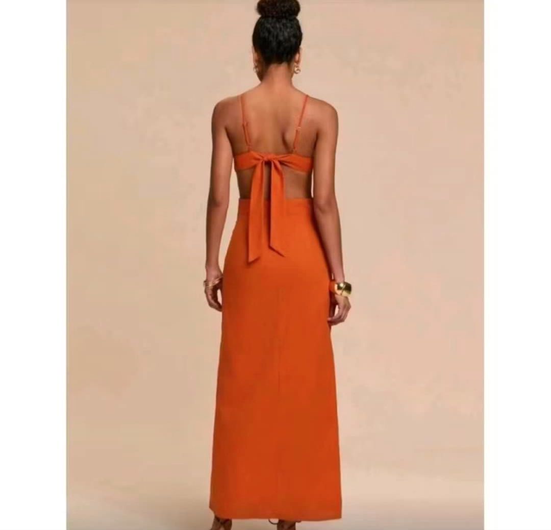 Orange Cut-out Maxi Dress with Tie Back (Category: Dresses) located in Mangatarem. Submitted by jvleexx (Listing ID 1446389900, Image 2). Description: - Vibrant orange maxi dress - Unique front cut-out detail - Delicate spaghetti straps - Adjustable tie-back closure - Flowy, floor-length skirt - Ideal for summer events and vacations - Effortlessly pairs with sandals - Used once in Bali.