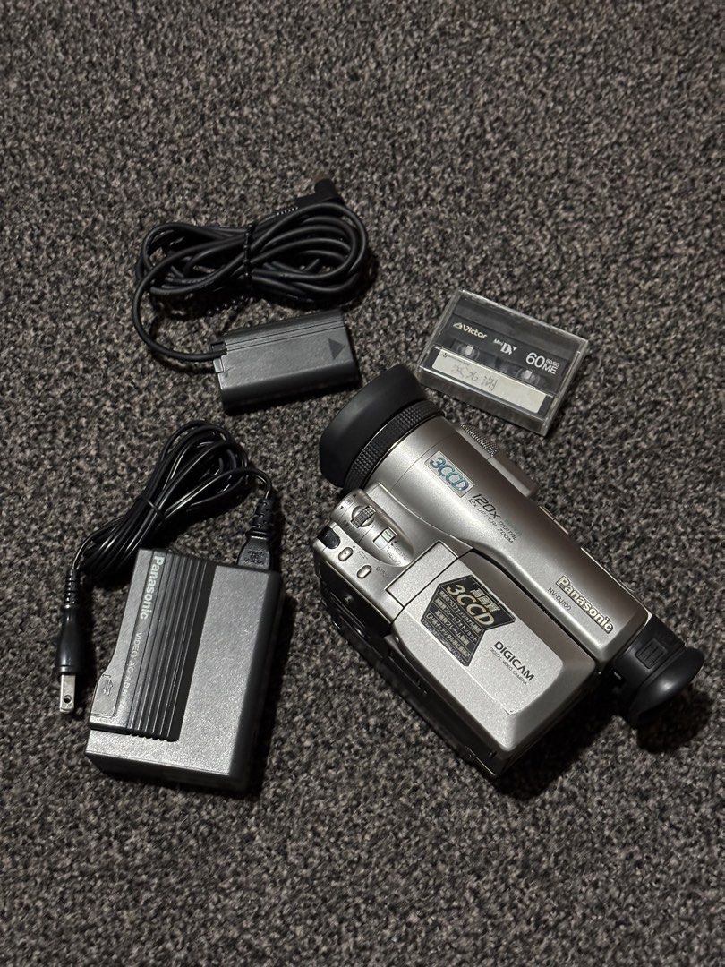 Panasonic Camcorder (Category: Video Cameras) located in Bulacan. Submitted by thriftstarph (Listing ID 1446421365, Image 1). Description: PLEASE READ THE DESCRIPTION BELOW‼️ PANASONIC NV-DJ100 3CCD MINI DV CAMCORDER GOOD WORKING NO BATTERY CHARGER ONLY NO SAMPLE VID ( walang ezcap cable pang transfer) ISSUE: DEFECTED LCD.