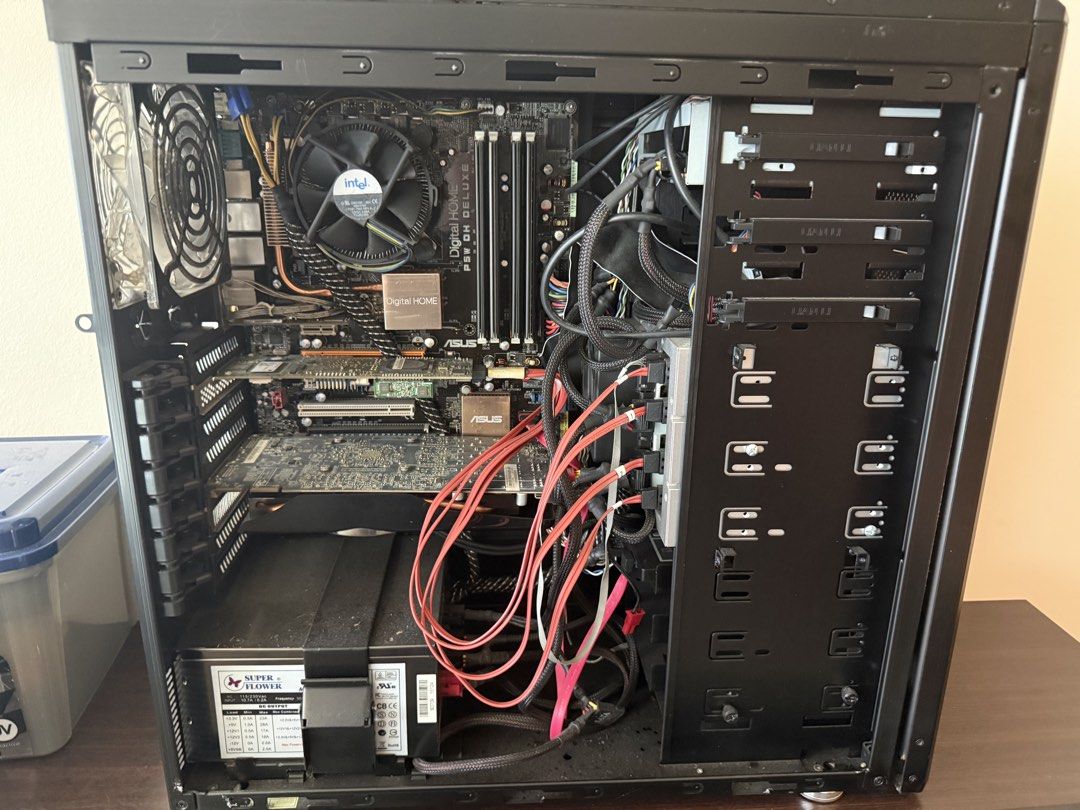 PC Intel Server setup (Category: Desktops) located in Singapore. Submitted by fajde (Listing ID 1446363451, Image 2). Description: - Black desktop computer tower case - Front-mounted Plextor optical drive - Internal Intel CPU cooler - Corsair RAM installed - Multiple drive bays available - Power supply unit included - Ready for your components Cannot remember CPU or Display adapter - got a raid adapter and hdd caddy for a home server setup. It is