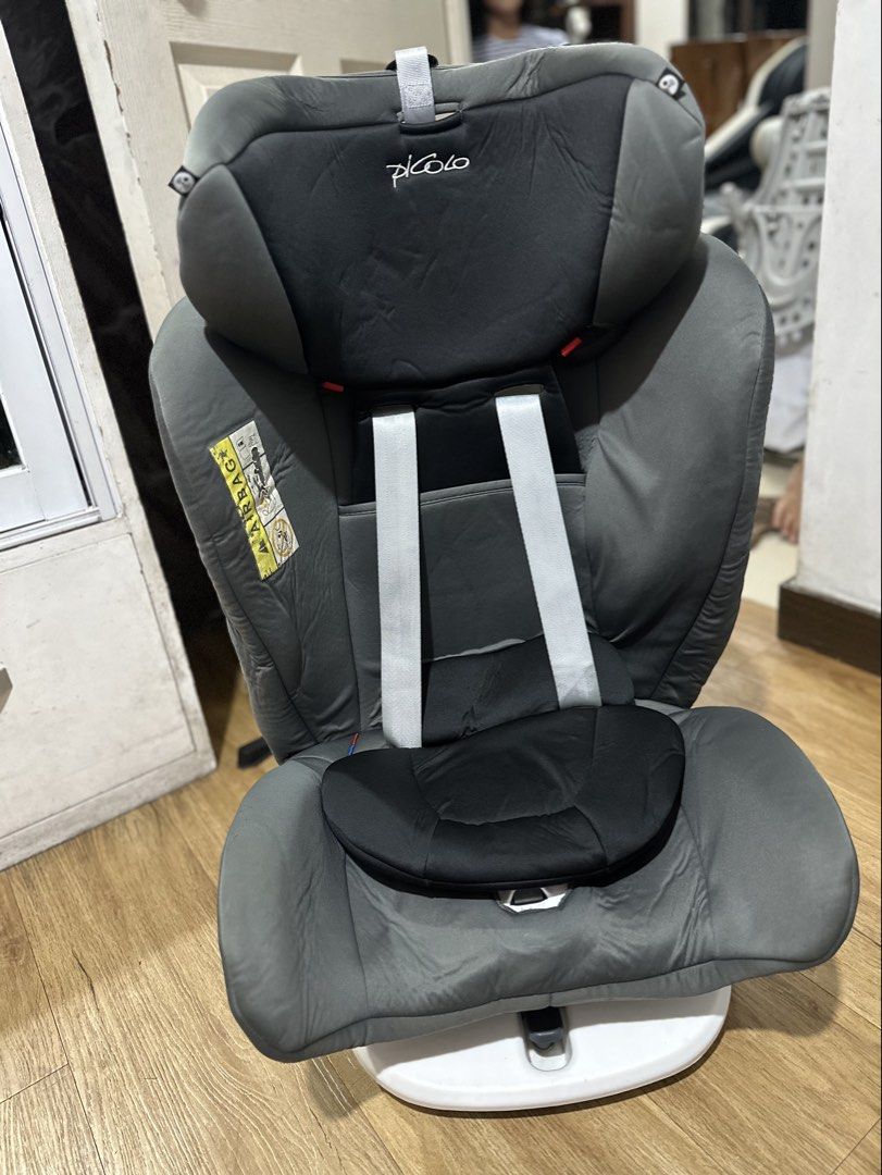 Picolo Car Seat (Category: Car Seats) located in Makati City. Submitted by kristine_p_a (Listing ID 1446485586, Image 1). Description: - Picolo car seat in grey and black - White base - 5-point harness for secure fastening - Adjustable headrest for comfort - Ideal for infants and toddlers - Ensures your child's safety during travel.