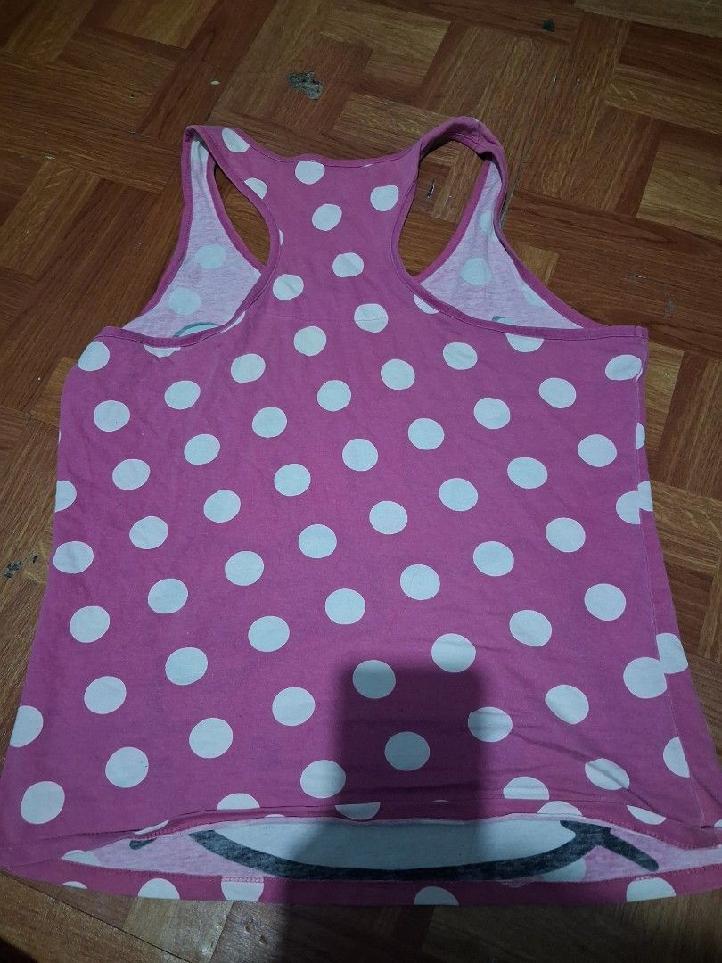 Pink Hello Kitty Polka Dot Tank Top y2k (Category: Sleeveless) located in Manila. Submitted by zafi_ (Listing ID 1446428989, Image 2). Description: - Cute pink tank top - White polka dot pattern - Large Kitty graphic on front - Racerback style - Soft and comfortable fabric - Ideal for casual wear or lounging - Fun and playful design.