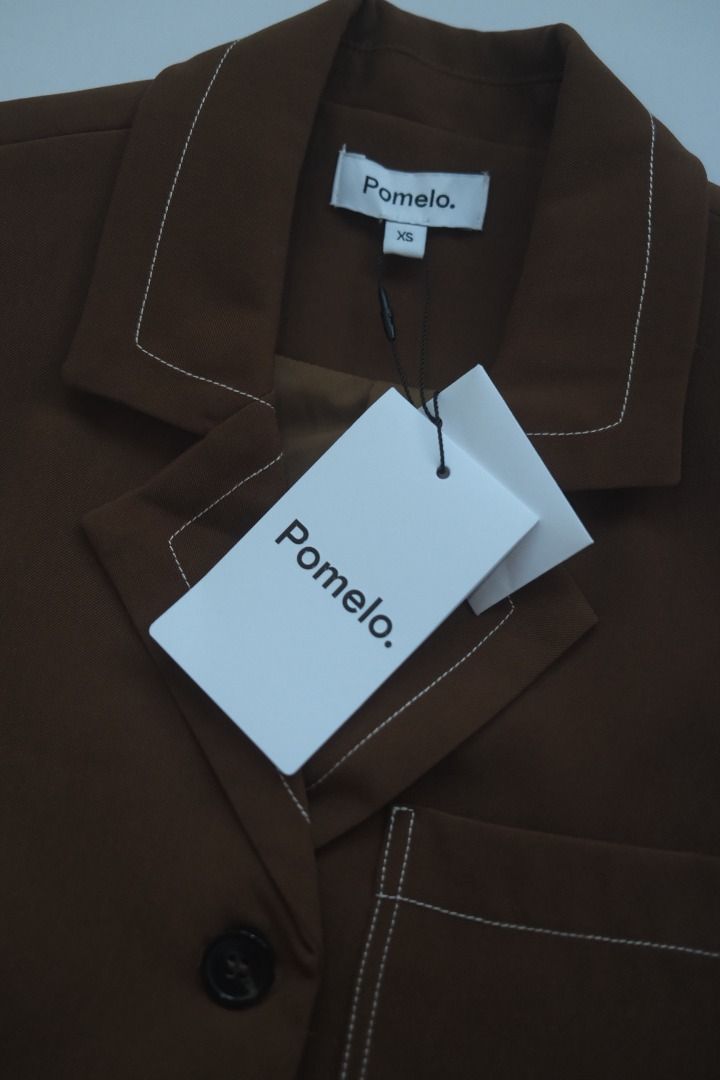 Pomelo Brown Sleeveless Vest with White Stitching (Category: Sleeveless) located in Naga. Submitted by billysstuff (Listing ID 1446468100, Image 2). Description: - Brand: Pomelo - Type: Sleeveless Vest - Color: Brown - Size: XS - Details: Contrast white stitching, raw hem, collar, button-up front, single chest pocket, shoulder pads - Style: Great for layering.