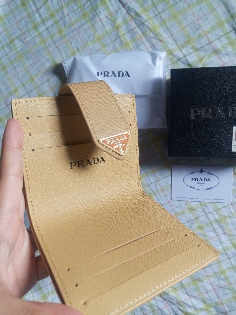 Prada Inspired Saffiano Leather Wallet with Box (Beige) (Category: Wallets & Card holders) located in Manila. Submitted by rhian_04 (Listing ID 1446398749, Image 2). Description: Selling this high-quality Prada inspired compact wallet. Very elegant and perfect for everyday use. Style: Inspired piece (Premium/Top Grade Quality) Material: Saffiano leather texture Color: Beige / Khaki Inclusions: Comes with the box, wrapper, and card as seen in the 
