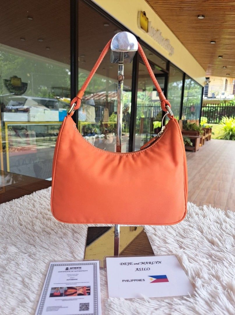 Prada Orange Nylon Hobo Bag (Category: Luxury Bags & Wallets) located in Tagum. Submitted by marny0503-00673 (Listing ID 1446370800, Image 2). Description: 💠💠💠 Authentic/Original 💠💠💠 Re-Edition Tessuto Mini Baguette Bag, Pre-owned‼️‼️👜👜 Inclusions: ✅️ COA ✅️ Paypal fee/deduction ➕️ shipping fee depends on the country through DHL. Tariff is excluded. Please check your recent address if the same in your paypal address it should be the same 