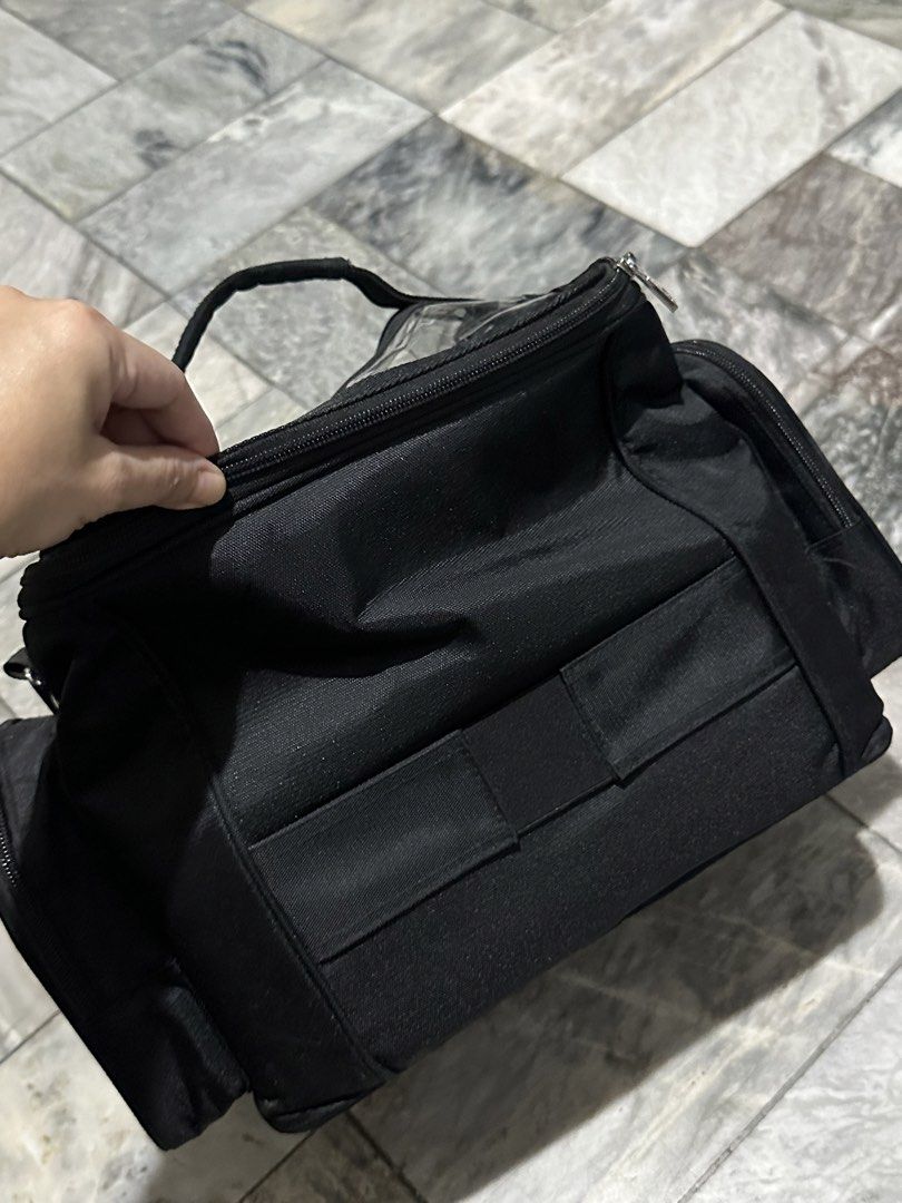 Relavel Black Makeup Train Case with Clear Compartments (Category: Makeup) located in Antipolo. Submitted by ttrends (Listing ID 1446518402, Image 3). Description: - Black Relavel makeup train case - Clear compartments for organization - Multiple side pockets - Top handle and detachable shoulder strap - Ideal for travel or professional use - Zippers function well ***please manage your expectation, it is a well-loved item and has normal signs of w