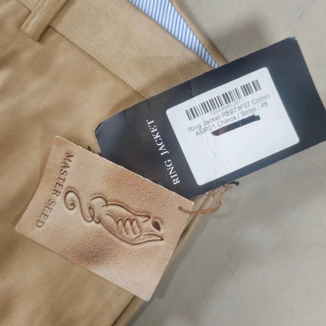 Ring Jacket RE073F07 Khaki Chino Pants (Category: Chinos) located in Roxas City. Submitted by fadesandpatinas (Listing ID 1446417019, Image 3). Description: Ring Jacket RE073F07 Khaki Chino Pants Tagged 48 Fits 32-33" Measurements: Waist - 16.7" Rise - 13" Thighs - 11.8" Inseam - 37" Length - 48" Hem - 8.1" Authentic Ring Jacket RE073F07 Khaki Chino Pants, expertly crafted in Japan using premium Master Seed® fabric, renowned for its superior fibe