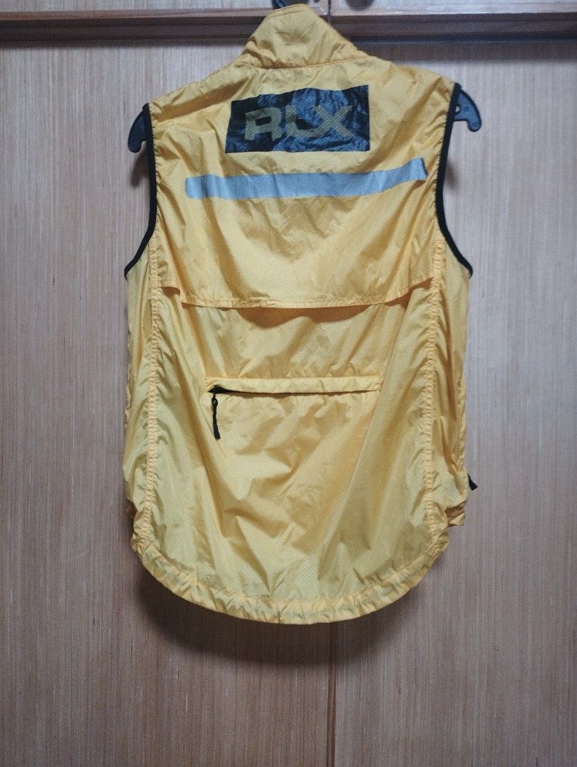 RLX Ralph Lauren Yellow Lightweight Packable Vest (Category: Coats, Jackets and Outerwear) located in Baguio. Submitted by katgon2016 (Listing ID 1446464979, Image 3). Description: - Yellow RLX Vest - Lightweight and packable for easy layering - Zip front closure with secure zip pockets - Reflective details on the back for visibility - Ideal for outdoor adventures or everyday casual wear - Folds up compactly for convenient storage.