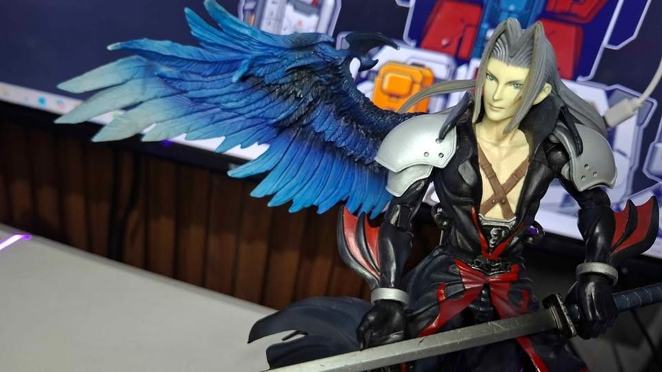 Sephiroth Play Arts Kingdom Hearts (Category: Figurines & Statues) located in Imus. Submitted by ToyBlazePH (Listing ID 1446383424, Image 1). Description: - Iconic Sephiroth action figure from Final Fantasy - Includes his signature sword and impressive large blue wings - Comes with a display base for showcasing - Features sharp details and clean paintwork - A must-have for any Final Fantasy enthusiast's collection.