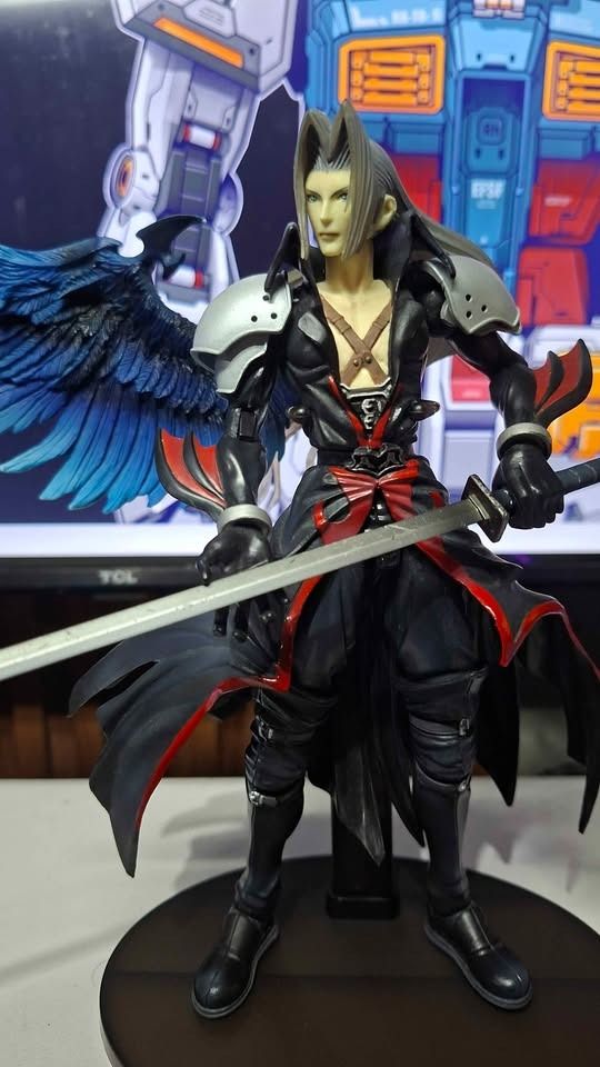 Sephiroth Play Arts Kingdom Hearts (Category: Figurines & Statues) located in Imus. Submitted by ToyBlazePH (Listing ID 1446383424, Image 2). Description: - Iconic Sephiroth action figure from Final Fantasy - Includes his signature sword and impressive large blue wings - Comes with a display base for showcasing - Features sharp details and clean paintwork - A must-have for any Final Fantasy enthusiast's collection.
