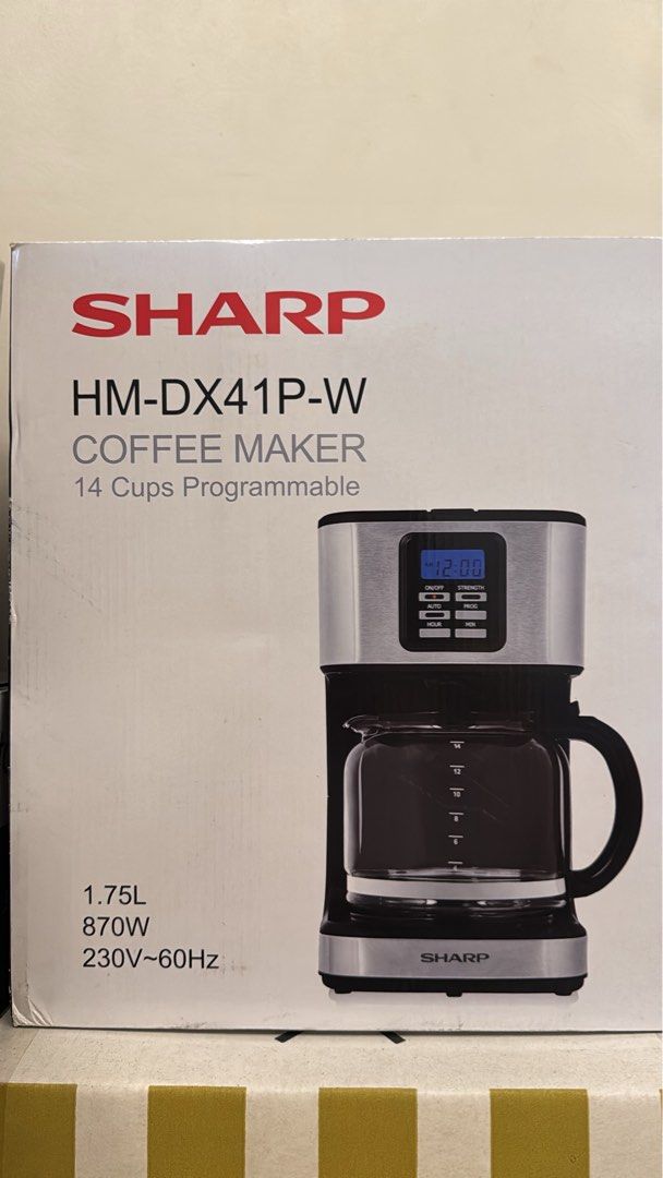 Sharp 14 Cups Programmable Coffee Maker (Category: Coffee Machines & Makers) located in Taguig. Submitted by trish78593 (Listing ID 1446374812, Image 1). Description: - Brand: Sharp - Model: HM-DX41P-W - Capacity: 14 cups (1.75L) - Programmable for convenience - Power: 870W - Voltage: 230V~60Hz - Ideal for your daily coffee needs.