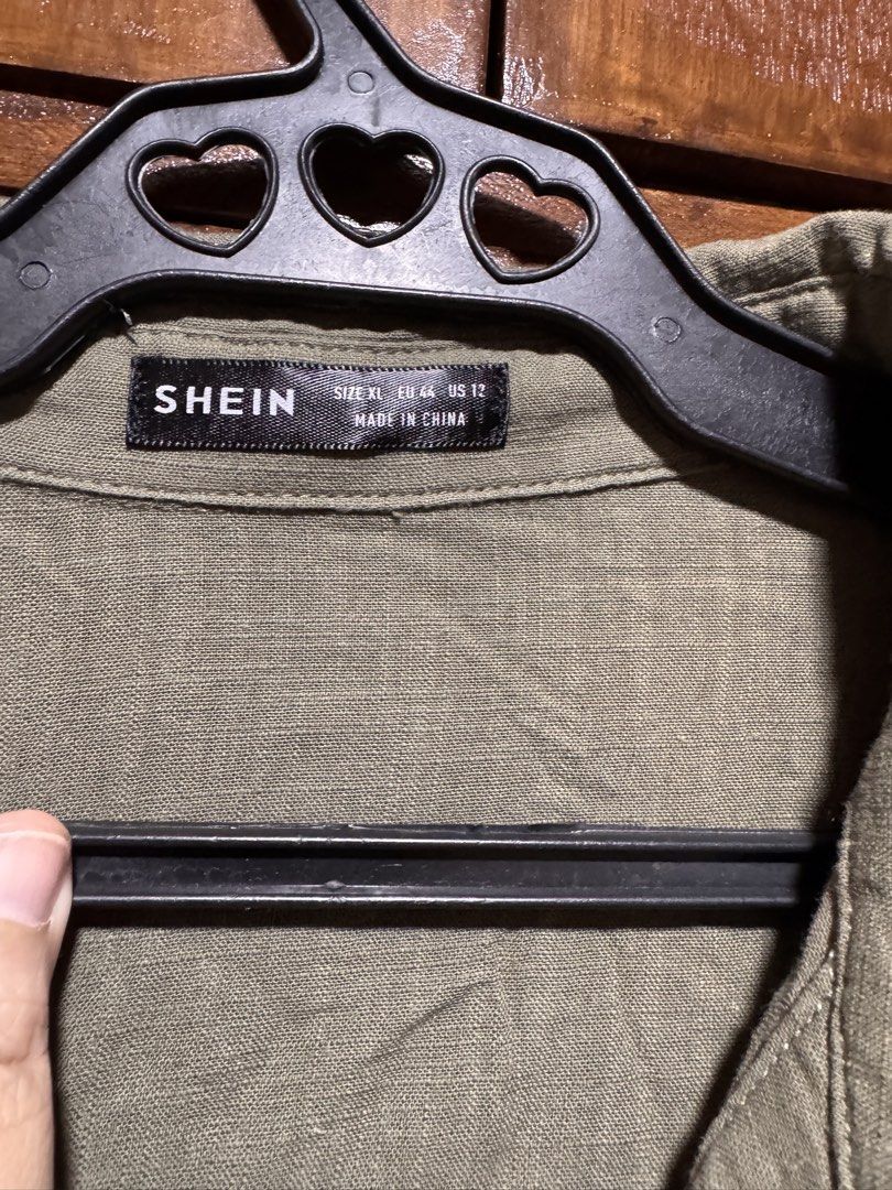 SHEIN Olive Green Button-Up Belted Romper XL (Category: Rompers) located in Quezon City. Submitted by KK_declutterluxx (Listing ID 1446435845, Image 3). Description: - Olive green romper from SHEIN - soft linen fabric - Button-up front with a collared neckline - Short sleeves and shorts - Comes with a matching fabric belt to cinch the waist - Ideal for casual outings - medium to large frame lang - never been used Sf c/o buyer.