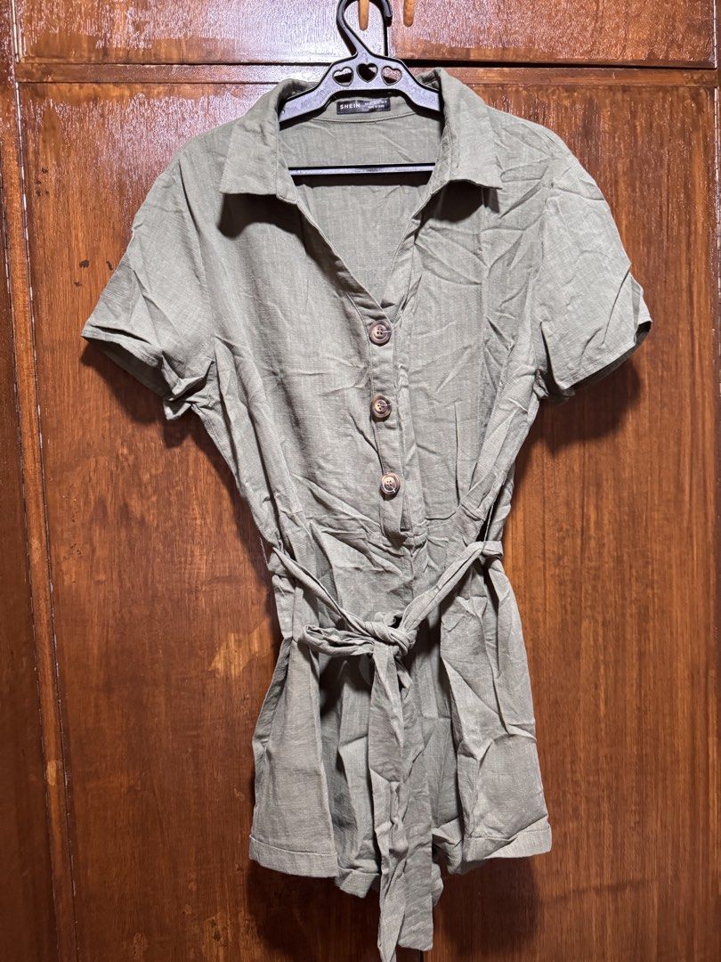 SHEIN Olive Green Button-Up Belted Romper XL (Category: Rompers) located in Quezon City. Submitted by KK_declutterluxx (Listing ID 1446435845, Image 2). Description: - Olive green romper from SHEIN - soft linen fabric - Button-up front with a collared neckline - Short sleeves and shorts - Comes with a matching fabric belt to cinch the waist - Ideal for casual outings - medium to large frame lang - never been used Sf c/o buyer.