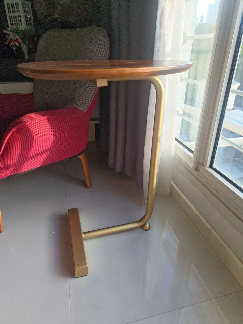 Side Table (Category: Chairs) located in Singapore. Submitted by freeman88.k (Listing ID 1446450363, Image 2). Description: - Stylish side table - Round wooden top with visible scratches - Gold-colored metal frame - Condition = 6.5 / 10 Deal at Bukit Batok Central near MRT..