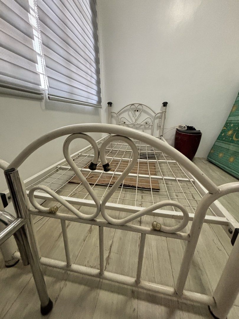 Single bed frame & semi double mattress (Category: Bed Frames & Mattresses) located in Las Pinas. Submitted by timelessthread (Listing ID 1446376084, Image 2). Description: - White metal single bed frame - 36 × 75 inches bed frame size - with a decorative heart design on the headboard - Comes with a semi-double mattress - Mattress is 5” thick - Ideal for single or semi-double bed setup - no defect madumi lang sa kalumaan at nakatambak lang - ship