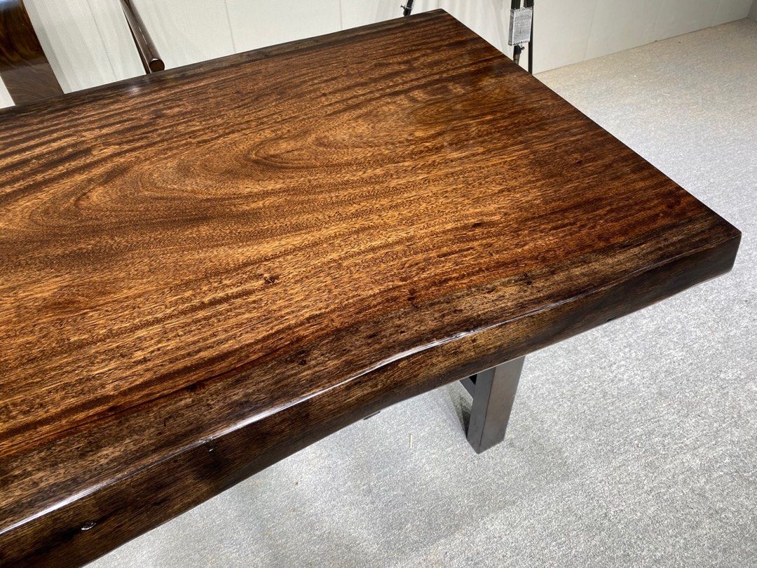 Solid Zebra Wood Dining Table / Study Table (Category: Tables & Sets) located in Singapore. Submitted by lukel6 (Listing ID 1446349015, Image 3). Description: - Beautiful solid slab Zebra wood dining table - Natural edge on both sides - Dark wood finish with rich grain - Slab is 7cm thick. Dimensions: As shown in photo - Classy and well maintain table top. Definitely will be the centre piece in your house - Sits 6 - 8 people comfortably - Chairs 