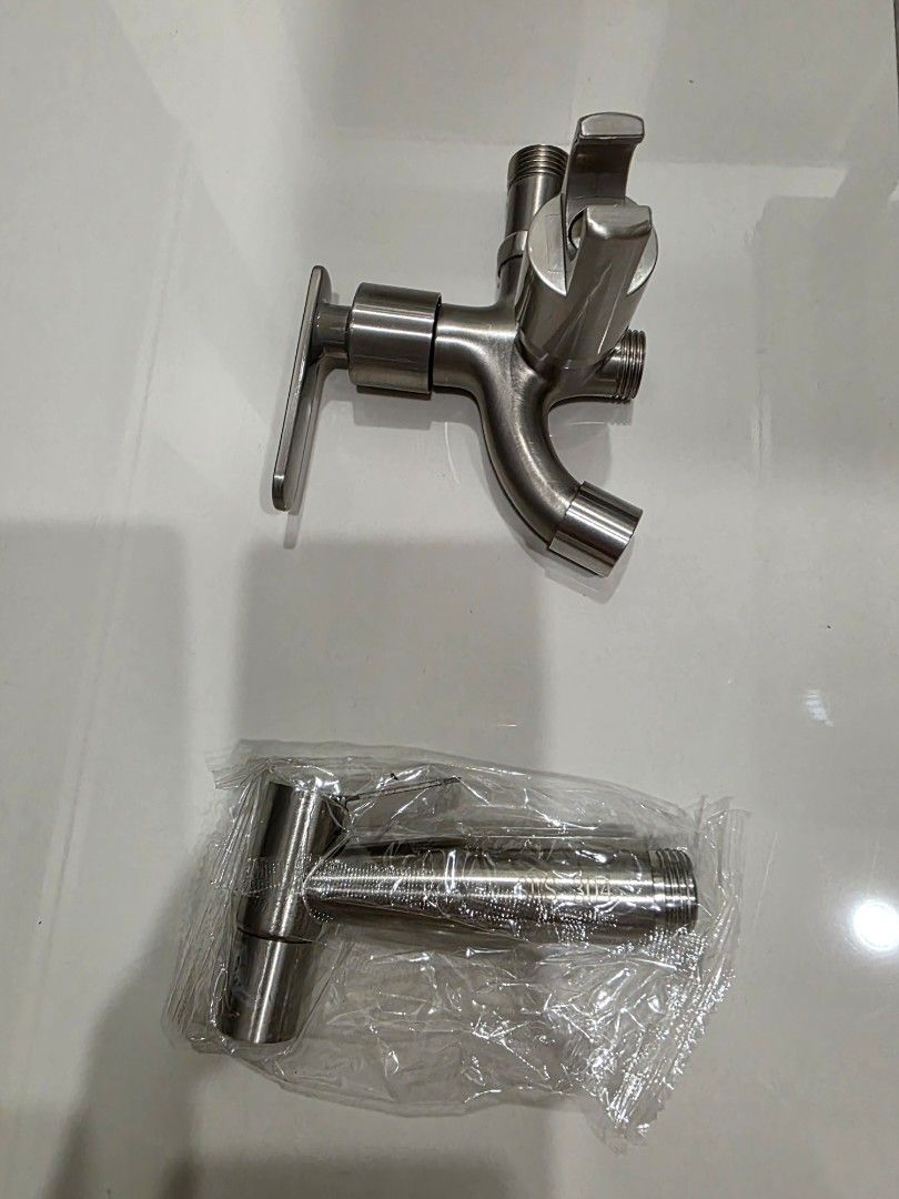 Stainless Steel Faucet with Dual Outlets (Category: Bathroom & Kitchen Fixtures) located in Klang. Submitted by ray3231989 (Listing ID 1446349471, Image 3). Description: - Durable stainless steel construction - Dual water outlets for versatility - Smooth, easy-to-operate handle - Comes with an extra threaded piece - Ideal for kitchen or bathroom upgrades and renovations.