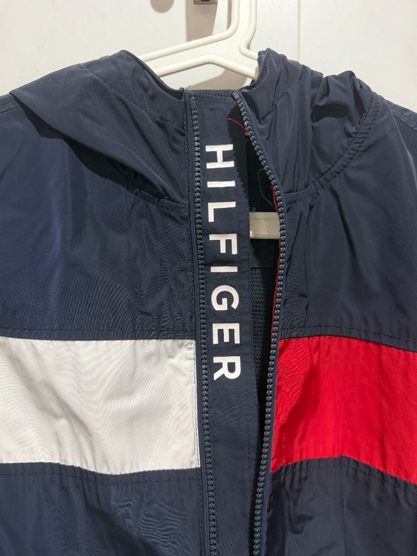 Tommy Hilfiger Colour Block Windbreaker Jacket (Category: Coats, Jackets and Outerwear) located in Mandaluyong City. Submitted by kayechx (Listing ID 1446496942, Image 3). Description: - Classic Tommy Hilfiger windbreaker - Iconic red, white, and blue color block design - Features a hood - Full zip closure - Tommy Hilfiger logo on the sleeve - Size S on tag but fits M-L - price SLIGHTLY negotiable, but not by a lot huhu already selling cheap sinc