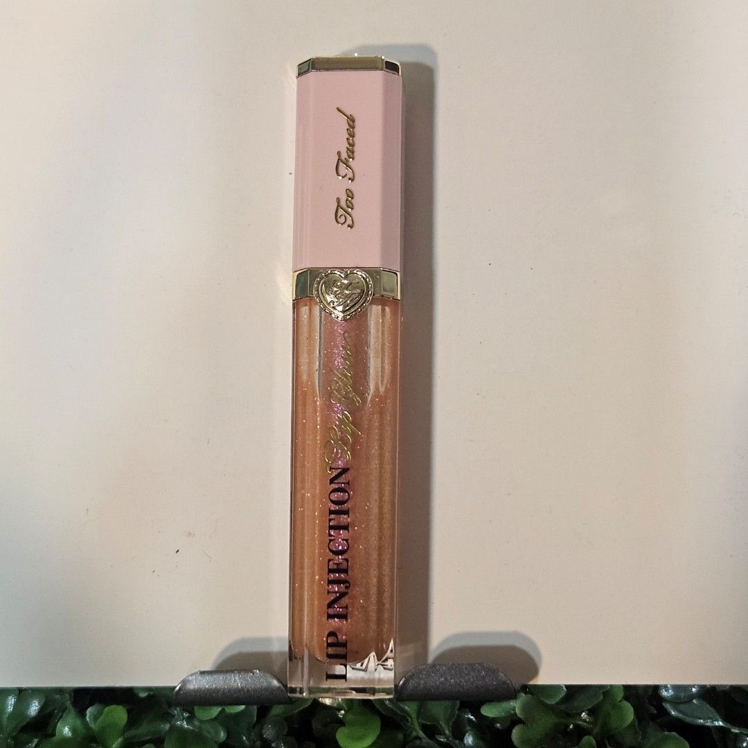 Too Faced Lip Injection Gloss (Category: Makeup) located in Imus. Submitted by a.niko (Listing ID 1446518245, Image 1). Description: - Too Faced Lip Injection gloss - Color: Shimmery peachy-pink - Effect: Plumps lips - Versatile for everyday or night out.