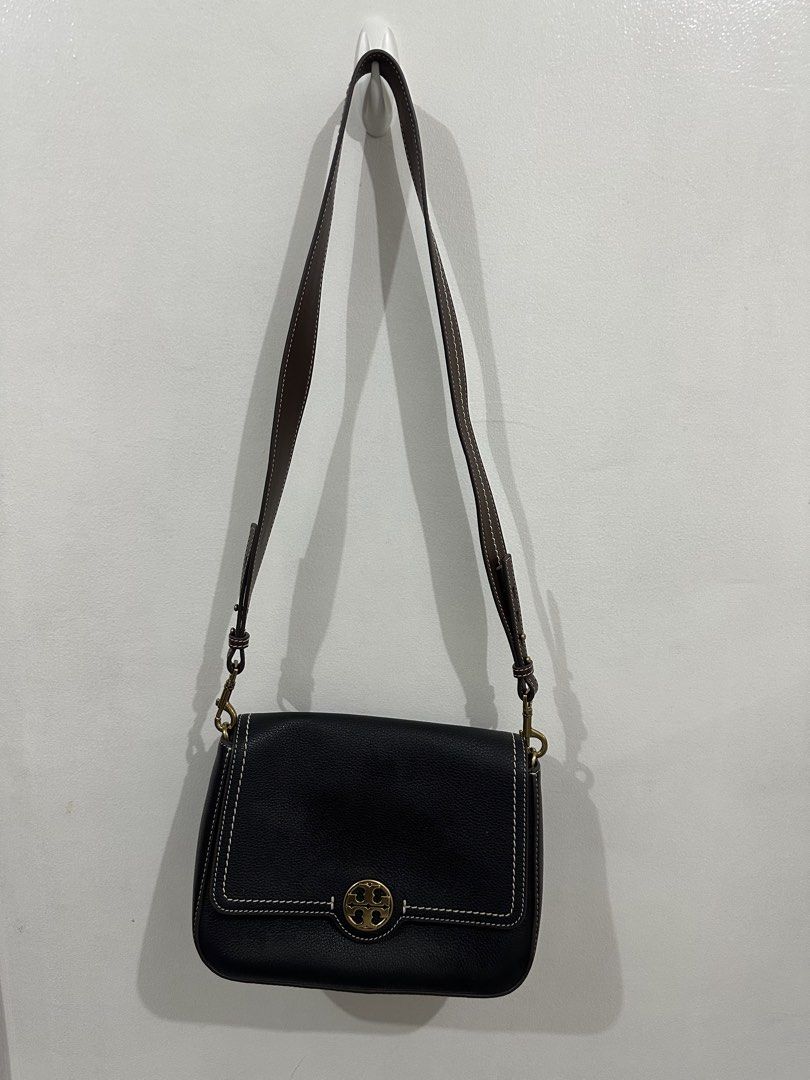 Tory Burch Felix Flap Bag (Category: Luxury Bags & Wallets) located in Manila. Submitted by caaaam_ (Listing ID 1446470500, Image 1). Description: - Authentic Tory Burch black leather shoulder - Iconic Tory Burch logo on the front - Adjustable strap for personalized comfort - Versatile for everyday errands or evening events - Clean interior - Comes with original dust bag for protection.