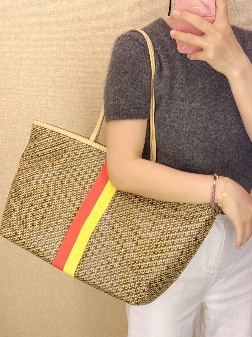 Tory Burch Racer Tote in Tan (Category: Tote Bags) located in Manila. Submitted by mahaechn (Listing ID 1446394406, Image 2). Description: 📌 ON HAND ‼️ 👜 Tory Burch Racer Tote ✨ Brand new and sealed — with dust bag & paper bag! Super cute, compact, and perfect for your daily lakads or errands! Stylish yet spacious for all your essentials. 📏 Size: Height: 11.2" (28.5cm); length: 13.8" (35cm); depth: 5.5" (14cm) ✅ With dust bag & paper bag ✅ Bra