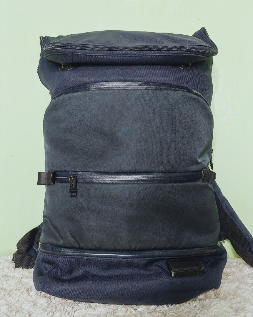 Tumi Tahoe Forest Backpack with Rain Cover (Category: Luxury Bags & Wallets) located in Iloilo. Submitted by blancroger_tumi (Listing ID 1446375107, Image 1). Description: - Tumi Tahoe Forest Flapbackpack - Multiple compartments for excellent organization - Includes original Tumi branded rain cover - Padded straps for maximum comfort during commutes or travel - Durable top leather handle & Nylon Materials - Smooth, high-quality zippers - In good,
