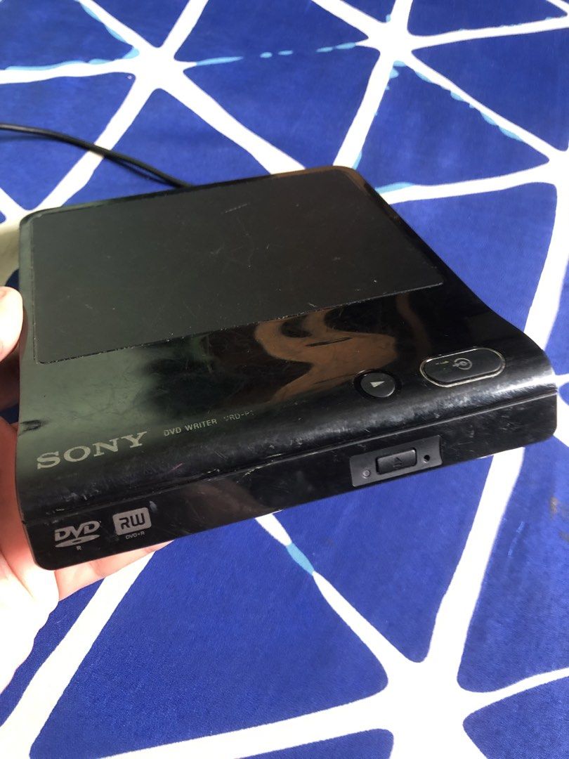 Untested Sony DVD RW drive (Category: Portable Audio Accessories) located in Quezon City. Submitted by markgolveo (Listing ID 1446380052, Image 1). Description: Untested Sony DVD RW drive Signs of body wears on shell case Untested as declared Usb cable end is uncommon For parts out repairs.