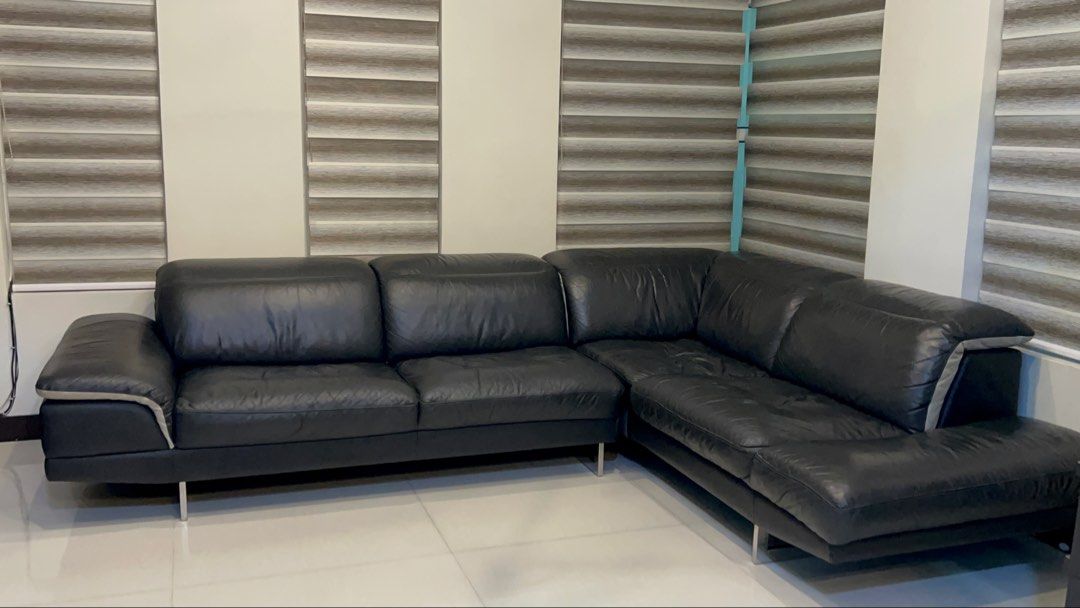 Used/pre love Black Leather L-Shaped Sectional Sofa (Category: Sofas) located in Manila. Submitted by lycahatesyou (Listing ID 1446527139, Image 2). Description: - WITH ISSUE PO PLS BROWSE EACH PICS — OG price is ₱170K -Modern L-shaped sectional sofa - Upholstered in sleek black leather - Features stylish metal legs - Comfortable seating for multiple people - Versatile configuration to fit your space - Ideal for living rooms and lounges.
