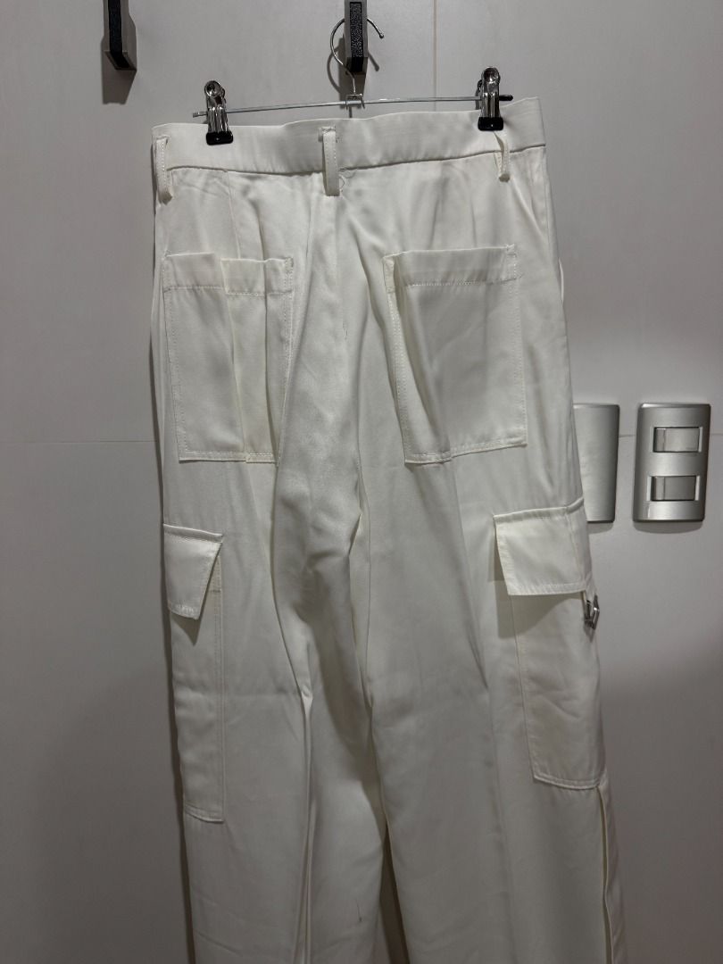 White Cargo Pants with Buckle Detail (Category: Other Bottoms) located in Mandaluyong City. Submitted by kayechx (Listing ID 1446495983, Image 3). Description: - White cargo pants - Buckle details on side pockets - Belt loops at waist - Two back pockets, two side pockets - Straight leg fit - Ideal for casual wear - price SLIGHTLY negotiable, but not by a lot huhu already selling cheap since i need closet space asap will give 10% discount if you b