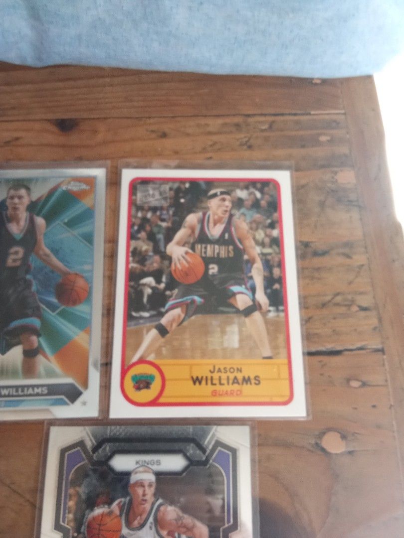 White chocolate Jason Williams cards lot (Category: Raw Singles) located in Pasig City. Submitted by teebeedeee (Listing ID 1446347624, Image 3). Description: - 3 Jason Williams basketball cards for sale. - Includes a card from his Memphis Grizzlies era. - Includes a card from his Sacramento Kings era. - Features an additional Jason Williams card. - All cards are in protective sleeves. - Great additions for any basketball card collector. in sleev