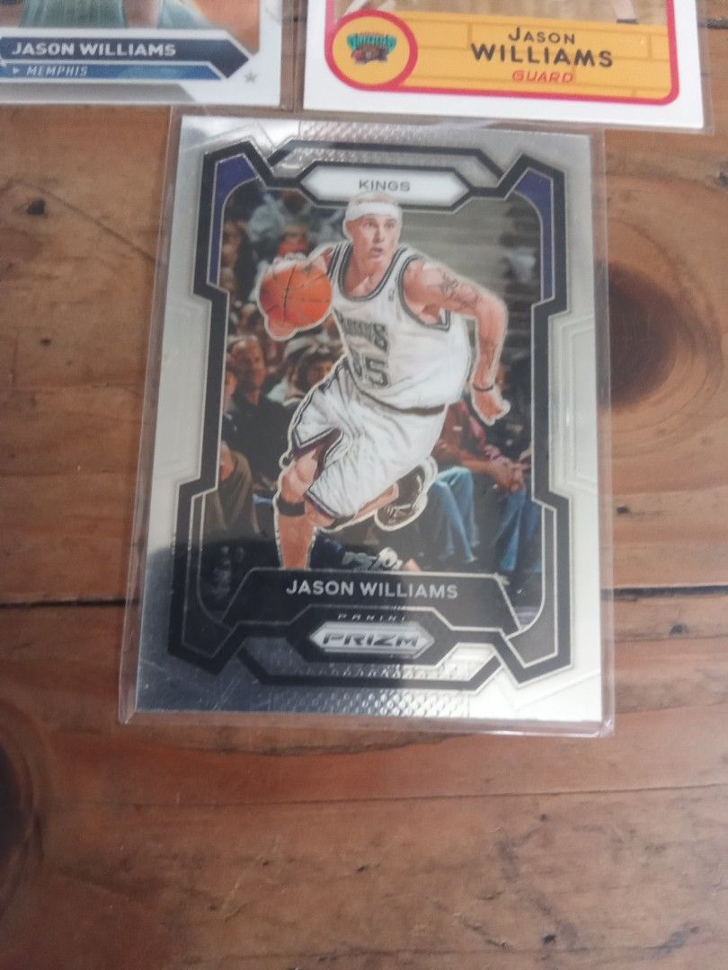 White chocolate Jason Williams cards lot (Category: Raw Singles) located in Pasig City. Submitted by teebeedeee (Listing ID 1446347624, Image 2). Description: - 3 Jason Williams basketball cards for sale. - Includes a card from his Memphis Grizzlies era. - Includes a card from his Sacramento Kings era. - Features an additional Jason Williams card. - All cards are in protective sleeves. - Great additions for any basketball card collector. in sleev