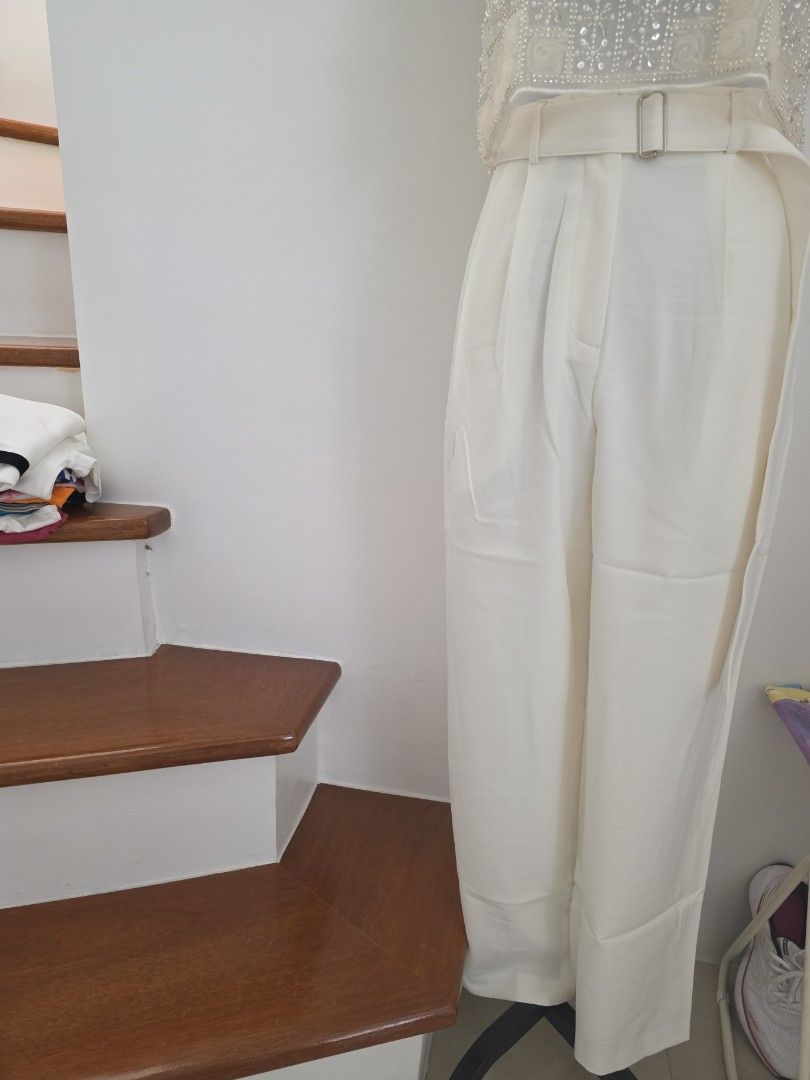 White Crop Top and Wide Leg Pants Set (Category: Sets or Coordinates) located in Cavite. Submitted by aikoaiko (Listing ID 1446312039, Image 3). Description: - Chic white two-piece set - Includes a sparkly crop top - High-waisted wide leg pants with matching belt - Ideal for parties or a night out - Comfortable and stylish design.
