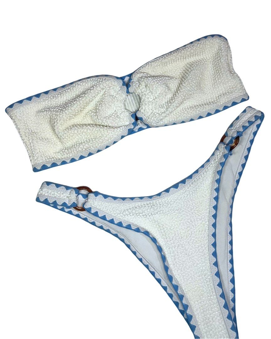 White Textured Bandeau Bikini with Blue Trim (Category: Bikinis & Swimsuits) located in Cagayan de Oro. Submitted by forevercurious (Listing ID 1446531014, Image 2). Description: - Cute textured bikini set - White with blue zigzag trim - Bandeau top with knot detail - Bottoms with ring details on the sides - Ideal for beach or pool days.
