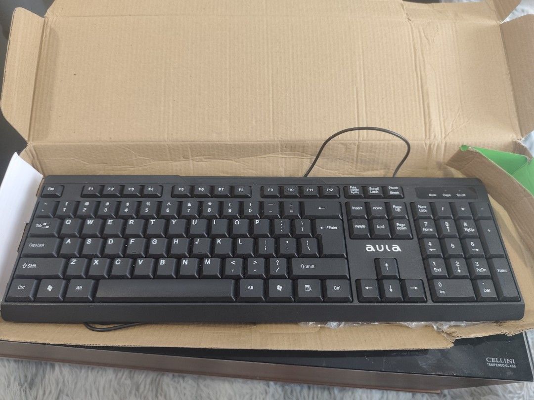 Wired Keyboard (Category: Computer Keyboard) located in Kuala Lumpur. Submitted by wct12 (Listing ID 1446358714, Image 1). Description: - Aula wired keyboard - Full-size layout with numeric keypad - Suitable for everyday typing and gaming - Simple plug-and-play setup - Ready for a new owner.