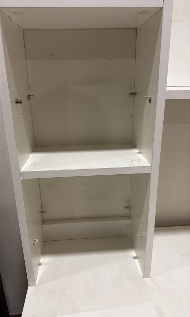 Working Table (Category: Other Home Furniture) located in Quezon City. Submitted by mycloset2yours82 (Listing ID 1446451685, Image 2). Description: IKEA Working Table Color: White Condition: With flaws (misaligned cabinet and drawer, crack on the side) Side shelves are adjustable in height FREE: AKARI desk lamp (shown in photo) RFS: renovating son’s room Buyer shoulder shipping. Pick up in QC.