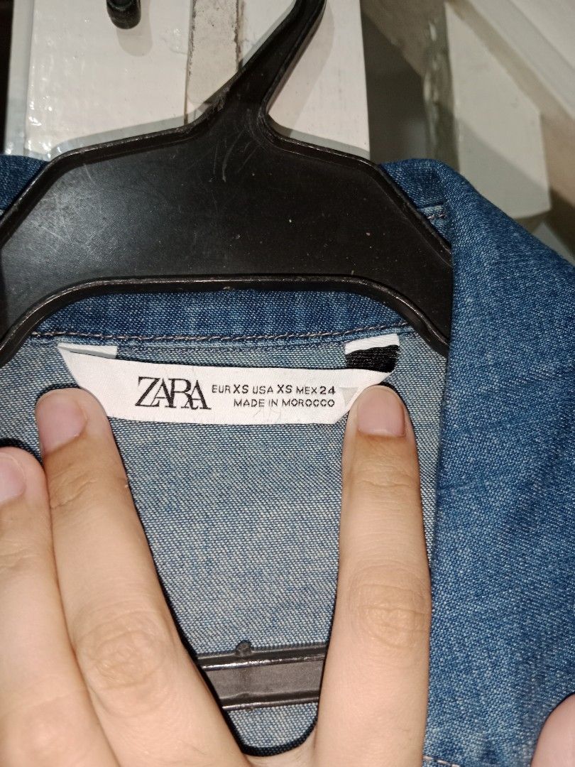 ZARA Denim Shirt - Blue (Category: Shirts) located in Manila. Submitted by yethquiday (Listing ID 1446384633, Image 2). Description: - Classic blue denim shirt from ZARA - Button-up front - Two chest pockets - Long sleeves with button cuffs - Made in Morocco - Versatile for layering or wearing on its own - fits small to semi medium.