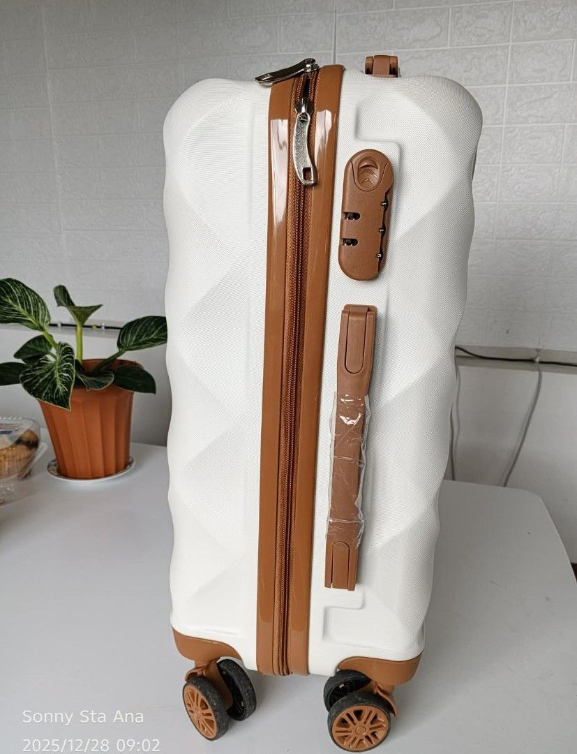 1time used-White Diamond Pattern Hardshell Luggage with Brown Accents (Category: Luggage) located in Quezon City. Submitted by gadgetsun (Listing ID 1446541329, Image 3). Description: - Stylish white hardshell luggage with a chic diamond pattern. - Elegant brown trim and detailing for a sophisticated look. - Secure your belongings with the built-in combination lock. - Effortless mobility to smooth-rolling wheels. - Convenient telescopic handle fo