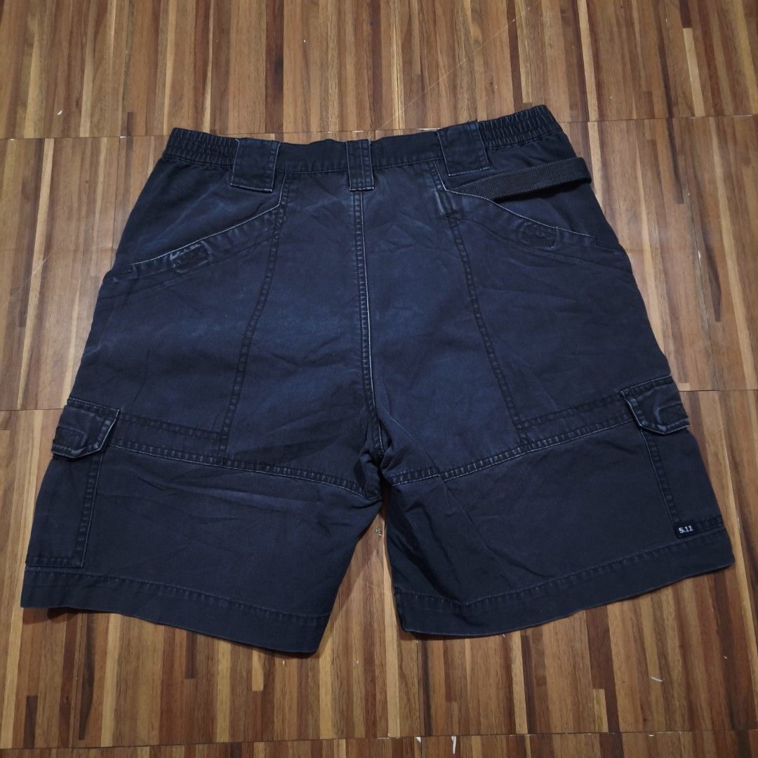 5.11 Tactical Series Cargo Shorts (Category: Shorts) located in Paranaque City. Submitted by bella0712 (Listing ID 1446563050, Image 3). Description: - Brand: 5.11 Tactical - Color: Dark Navy Blue - Material: 100% Cotton - Features: Multiple storage pockets, elastic waistband for comfort - Size: 32x19 - Ideal for: Outdoor activities, casual wear.