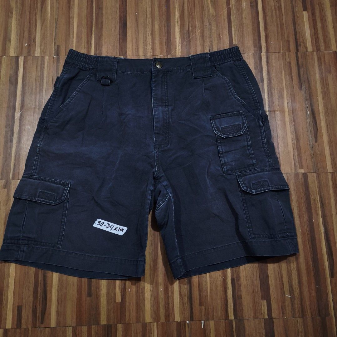 5.11 Tactical Series Cargo Shorts (Category: Shorts) located in Paranaque City. Submitted by bella0712 (Listing ID 1446563050, Image 1). Description: - Brand: 5.11 Tactical - Color: Dark Navy Blue - Material: 100% Cotton - Features: Multiple storage pockets, elastic waistband for comfort - Size: 32x19 - Ideal for: Outdoor activities, casual wear.