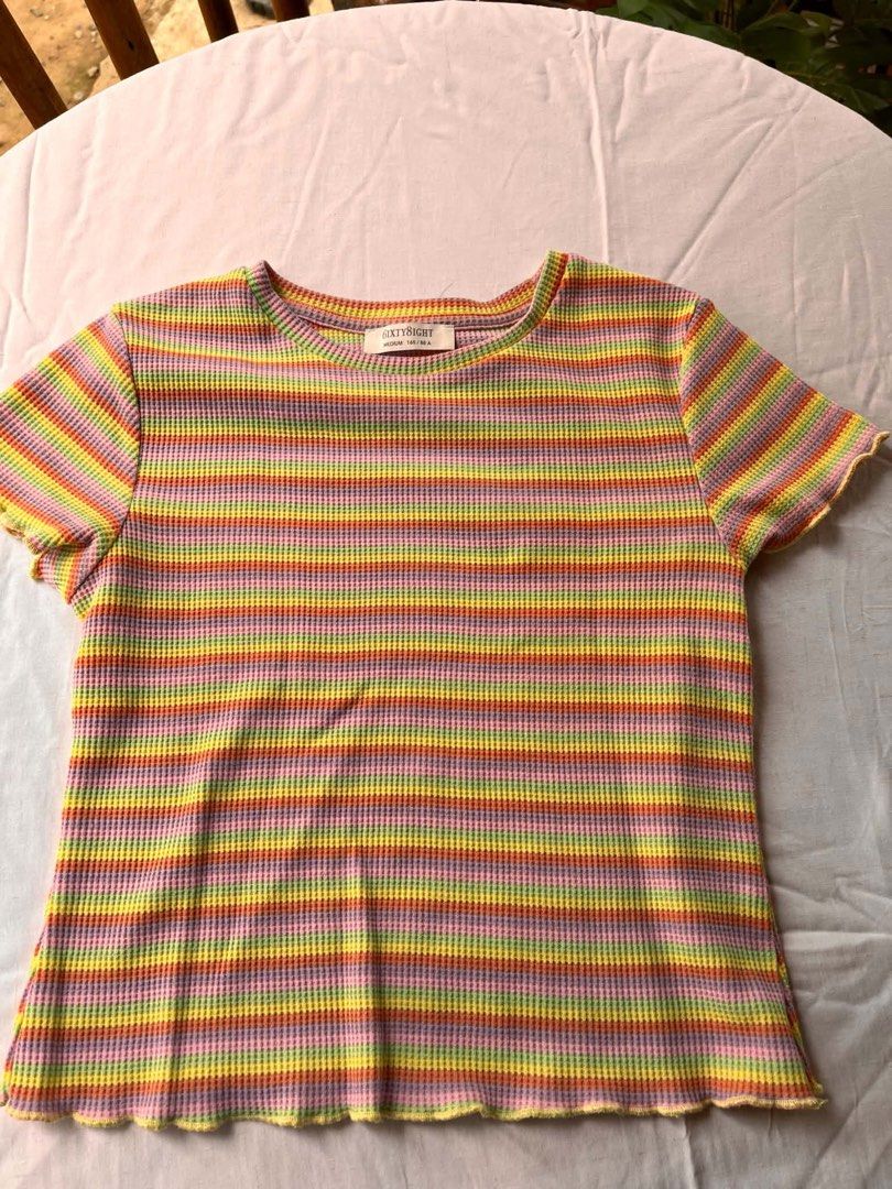 6ixty8ight Striped Waffle Knit T-shirt (Category: Shirts) located in Iloilo. Submitted by wanderzee (Listing ID 1446657968, Image 1). Description: - Brand: 6ixty8ight - Style: Waffle knit t-shirt - Design: Rainbow stripes (pink, yellow, orange, green, purple) - Features: Lettuce hem on sleeves and bottom - Occasion: Casual wear.