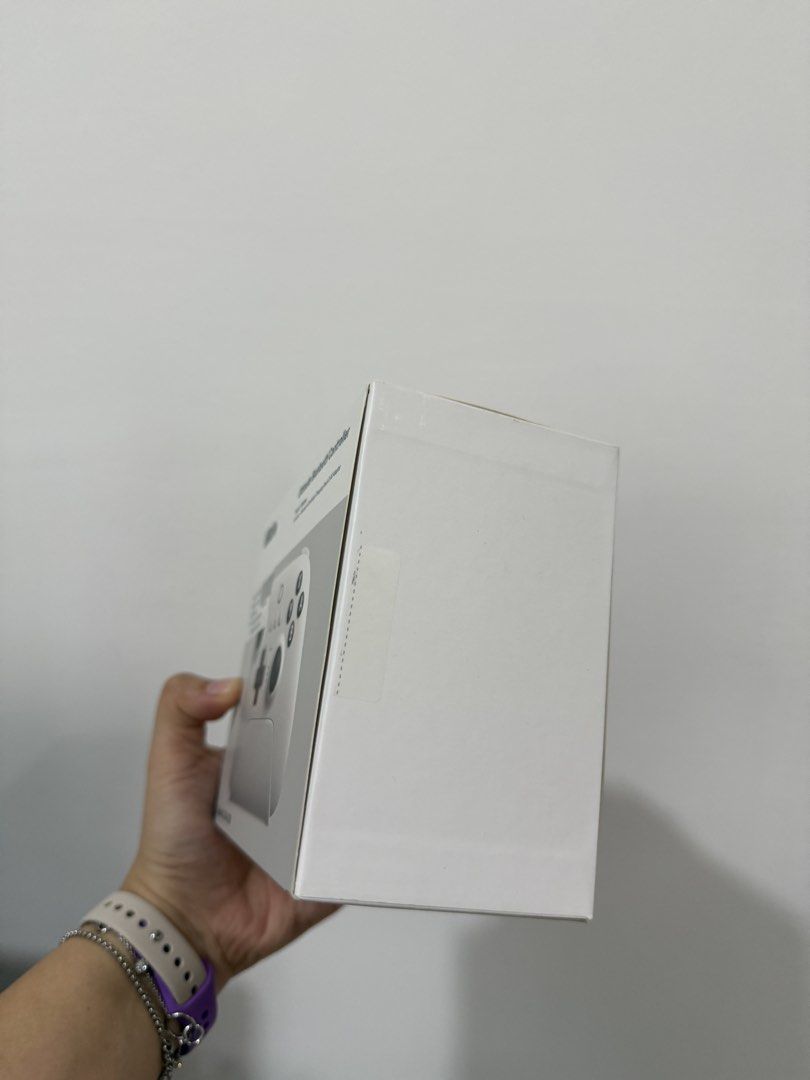 8BitDo Ultimate Bluetooth Controller White for Switch/Windows (Category: Controllers) located in Cyberjaya. Submitted by krsteasells (Listing ID 1446720977, Image 2). Description: - 8BitDo Ultimate Bluetooth Controller (White) - Compatible with Nintendo Switch and Windows PC - Multiple connectivity options: Bluetooth, 2.4G wireless, USB wired - Includes convenient charging dock - Box has a slight dent on one side.