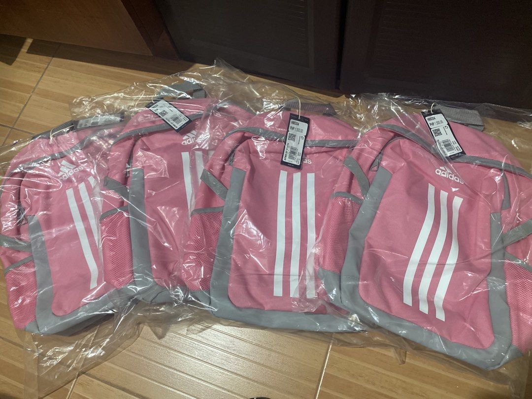 Adidas APWR BP Youth Backpack Pink (Category: Babies & Kids Fashion) located in Manila. Submitted by declutteringwithyen (Listing ID 1446562814, Image 2). Description: - Pink Adidas backpack with grey accents - Features iconic three stripes - Side mesh pockets for water bottles - Adjustable shoulder straps for comfort - Ideal for school or everyday use - Multiple units available.